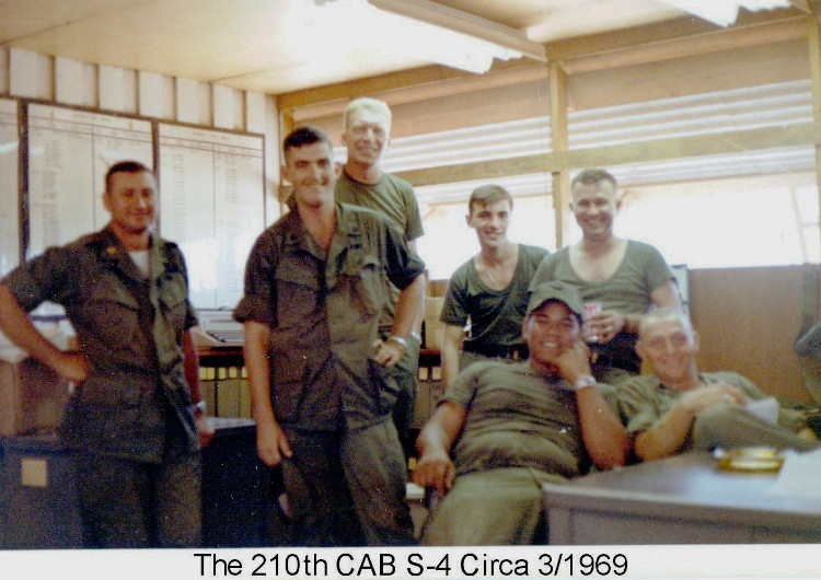 S4, 210th, office as of March 1969. From left, MAJ Hardy, S-4, Seated-left Prince of Kona, standing right SFC Haroland, or Pat Patterson, next to Pat is our clerk but I don't remember his name. Photo by Rich Hendrickson, CAC, 1968-69